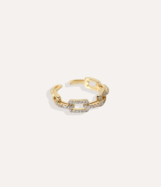 Glitz and Glam Ring Stack in 14k gold plated stainless steel, featuring a sparkling multi-ring design with small chain isolated on a white background.