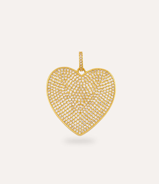 Gold heart-shaped charm on a light beige background
