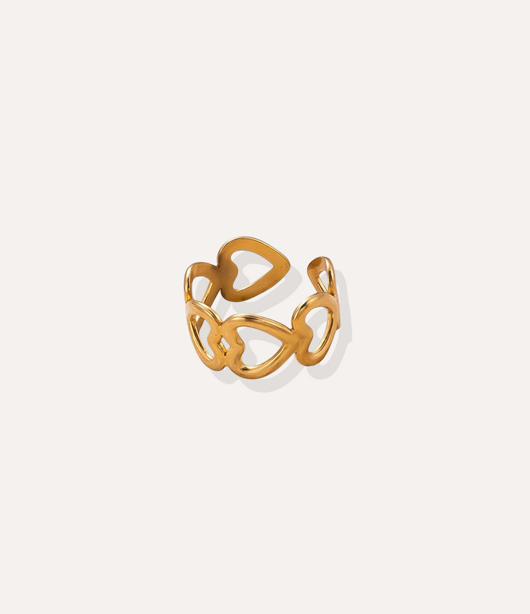Heart Link Ring in 18k gold plated stainless steel, featuring a chain of connected heart shapes and an adjustable band, isolated on white.