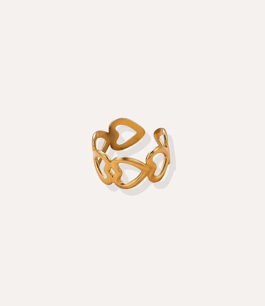 Heart Link Ring in 18k gold plated stainless steel, featuring a chain of connected heart shapes and an adjustable band, isolated on white.