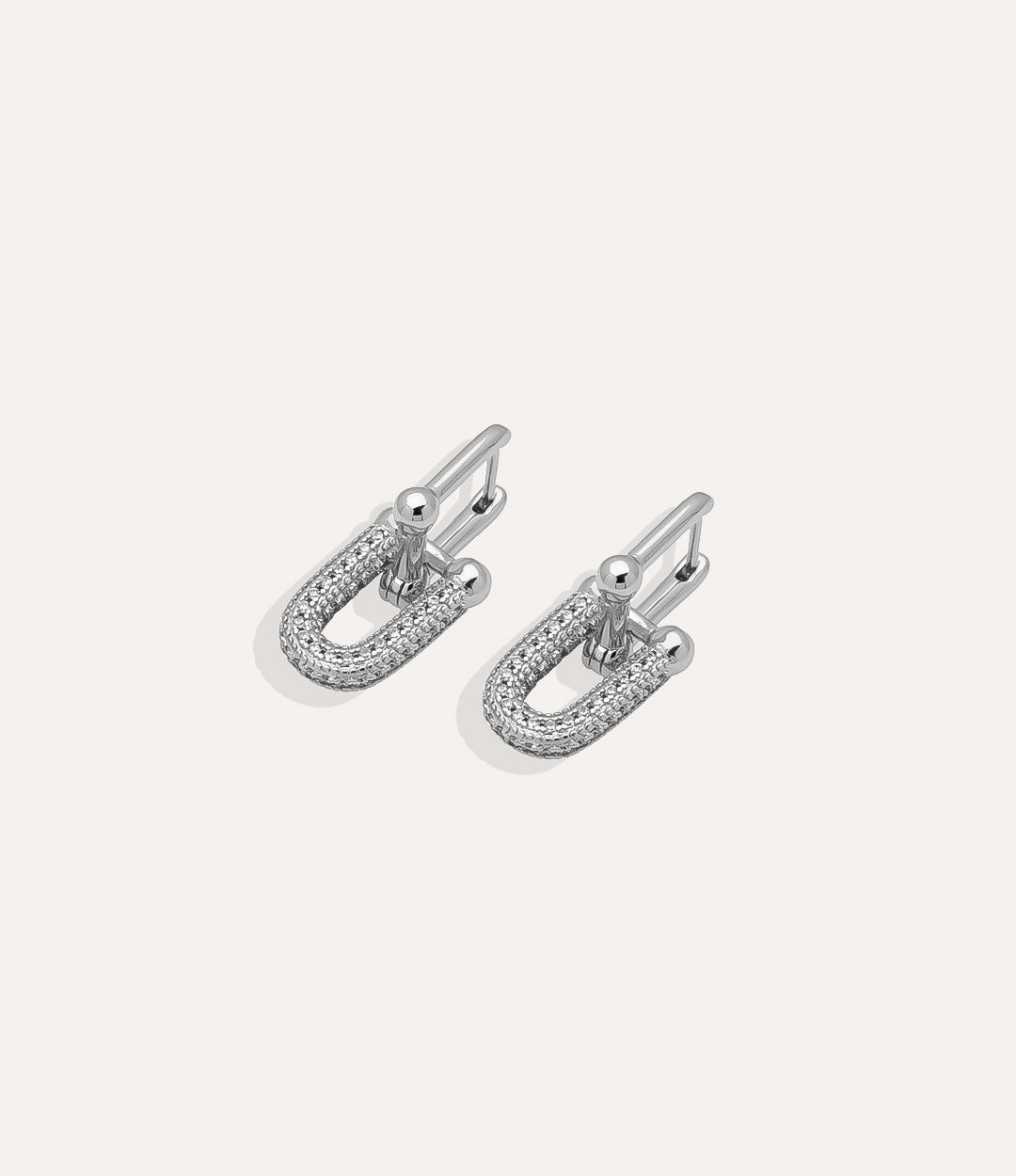 Silver Horse Bit Stud earrings showcasing linked horseshoe design in a modern minimalist style.