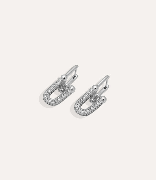Silver Horse Bit Stud earrings showcasing linked horseshoe design in a modern minimalist style.