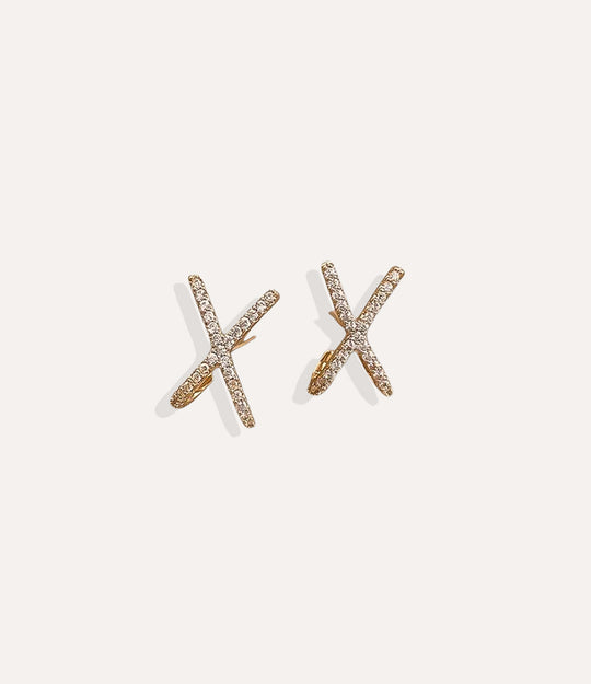 Close up of the Kisses Stud in gold, highlighting the sleek X-shaped design and polished finish.