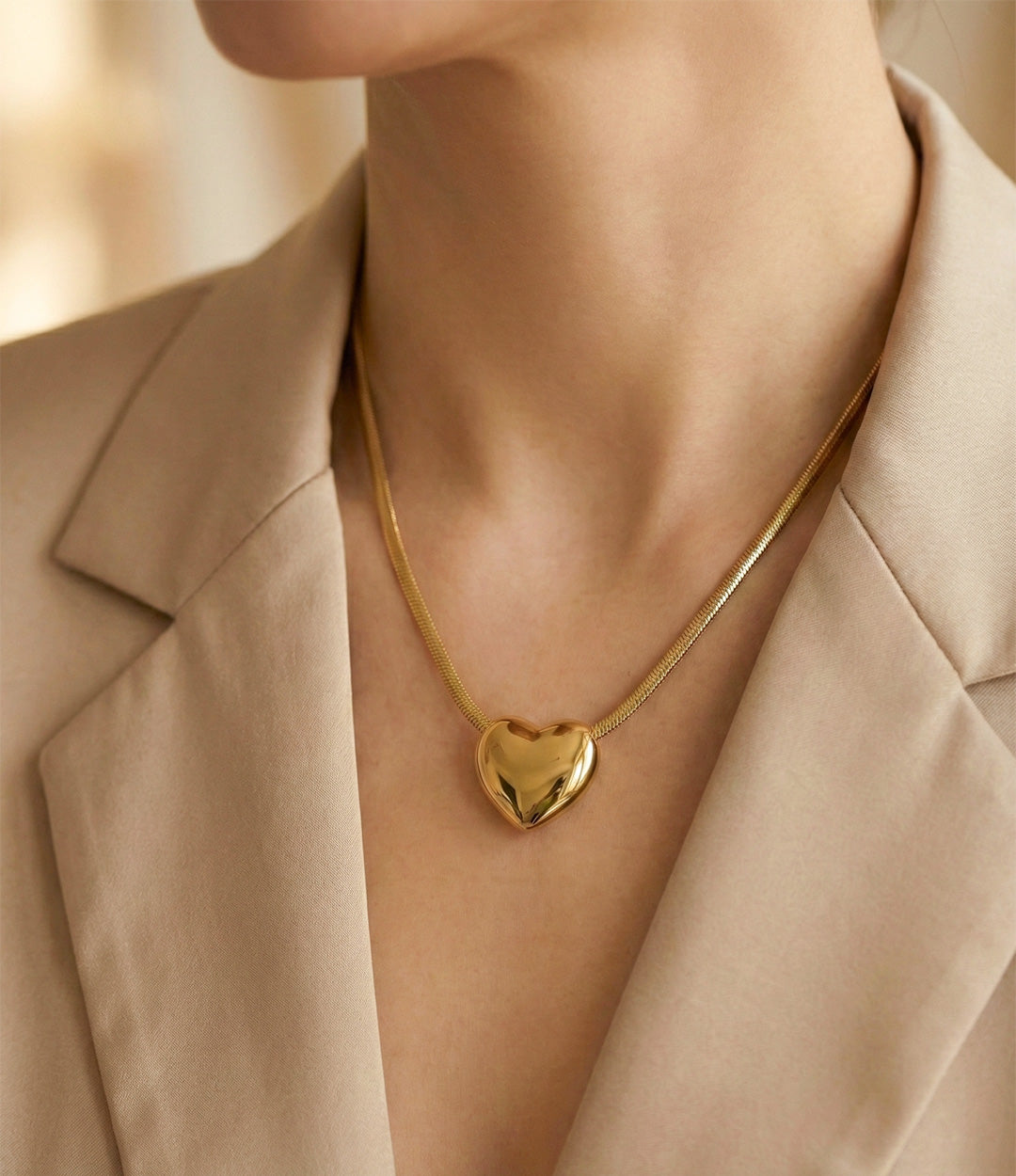 18k gold plated snake chain necklace displayed on model