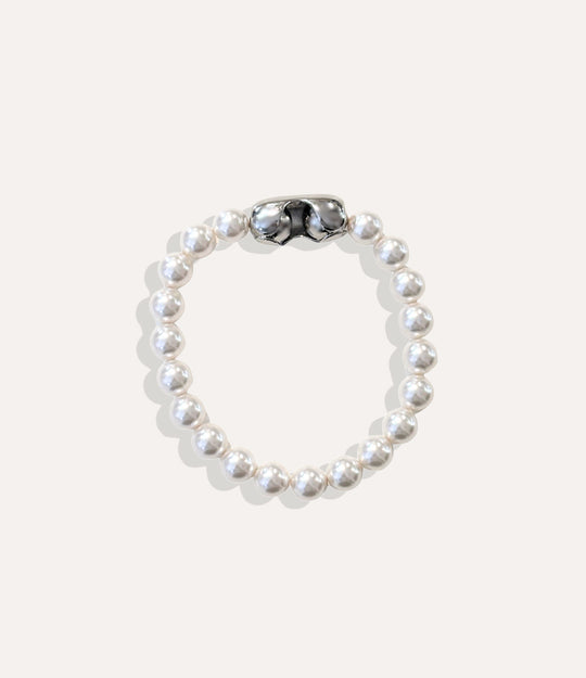Classic pearl bracelet with large 10mm pearls and sleek magnetic clasp displayed on neutral background