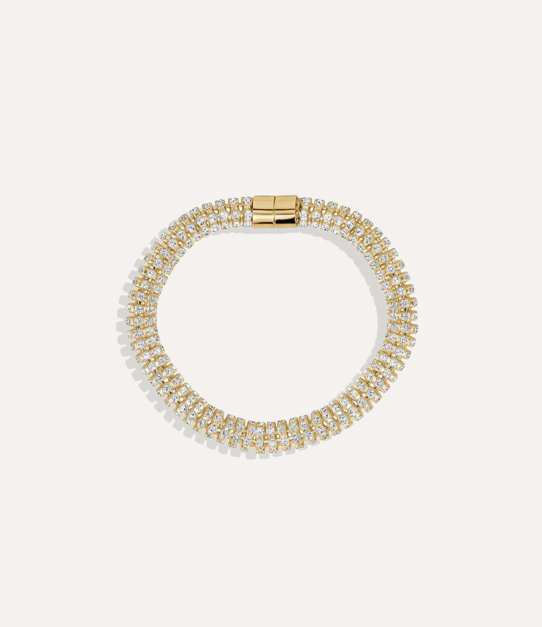 Gold Magnetic Tennis Bracelet with shimmering stones and magnetic closure displayed on a neutral background