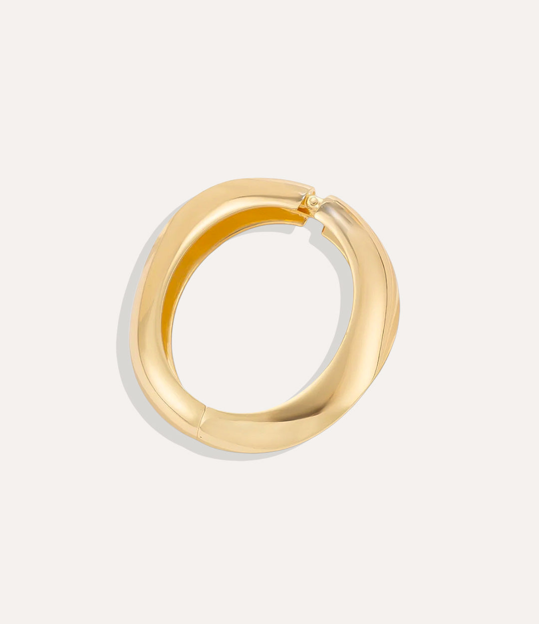 Chunky oversized Gold Mega Bangle displayed on a white background, showing its bold design