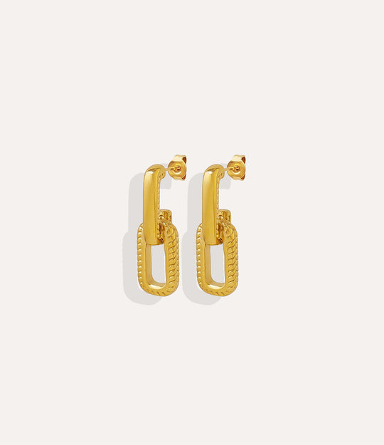 Product shot of the Mini Link Earrings in 14k gold plating displaying the open link shape and warm metallic finish on a white background.