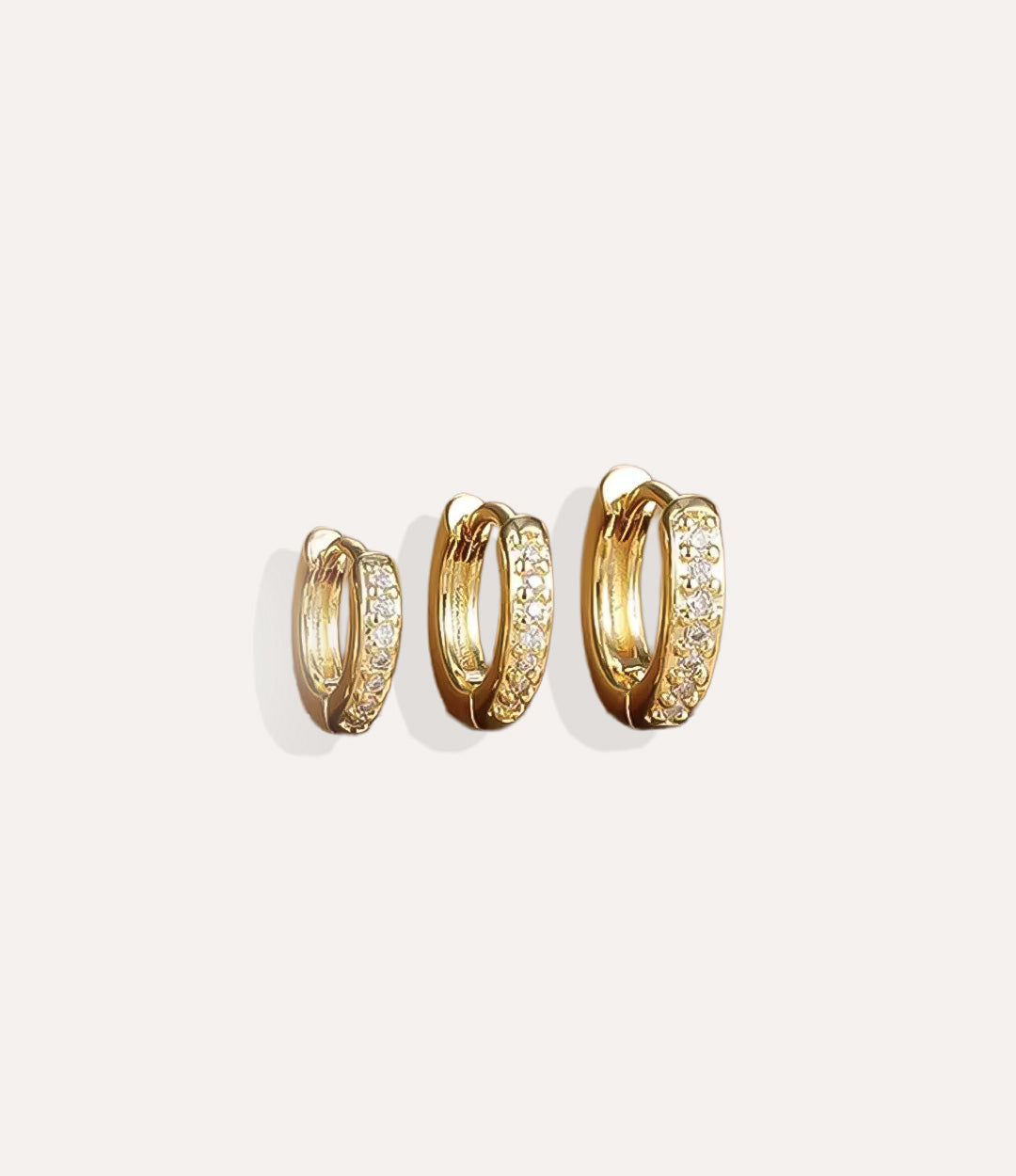 Close up of Mini Pave Hoops in gold highlighting the sparkling pave accents and polished finish.