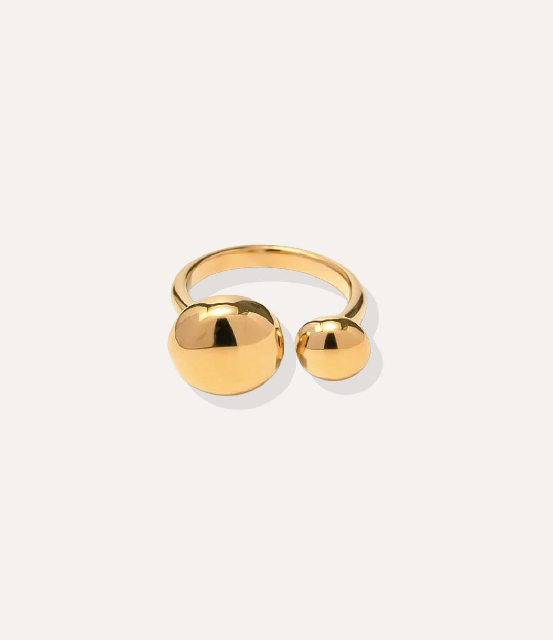 Mod Ball Ring in 18k gold plated finish, featuring a sleek open band with two gold spheres, isolated on a white background