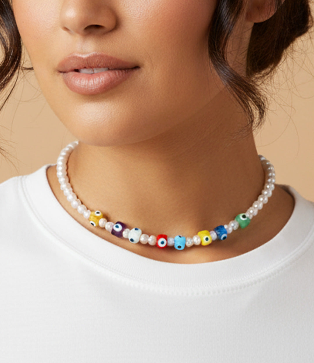 Woman wearing a multicolour eye necklace with pearls and colorful glass beads
