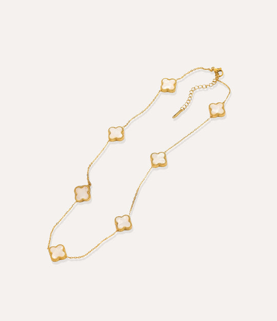 Gold and white multiple clover necklace displayed on white background