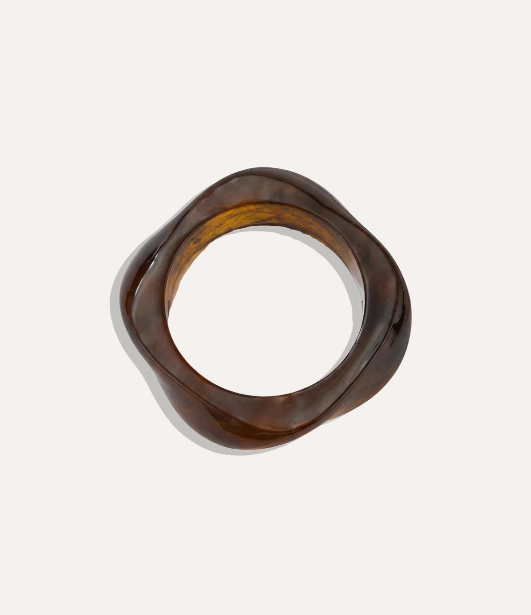 Brown acrylic resin bangle in organic free-form silhouette