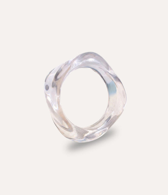 Clear acrylic resin bangle with fluid, sculptural shape