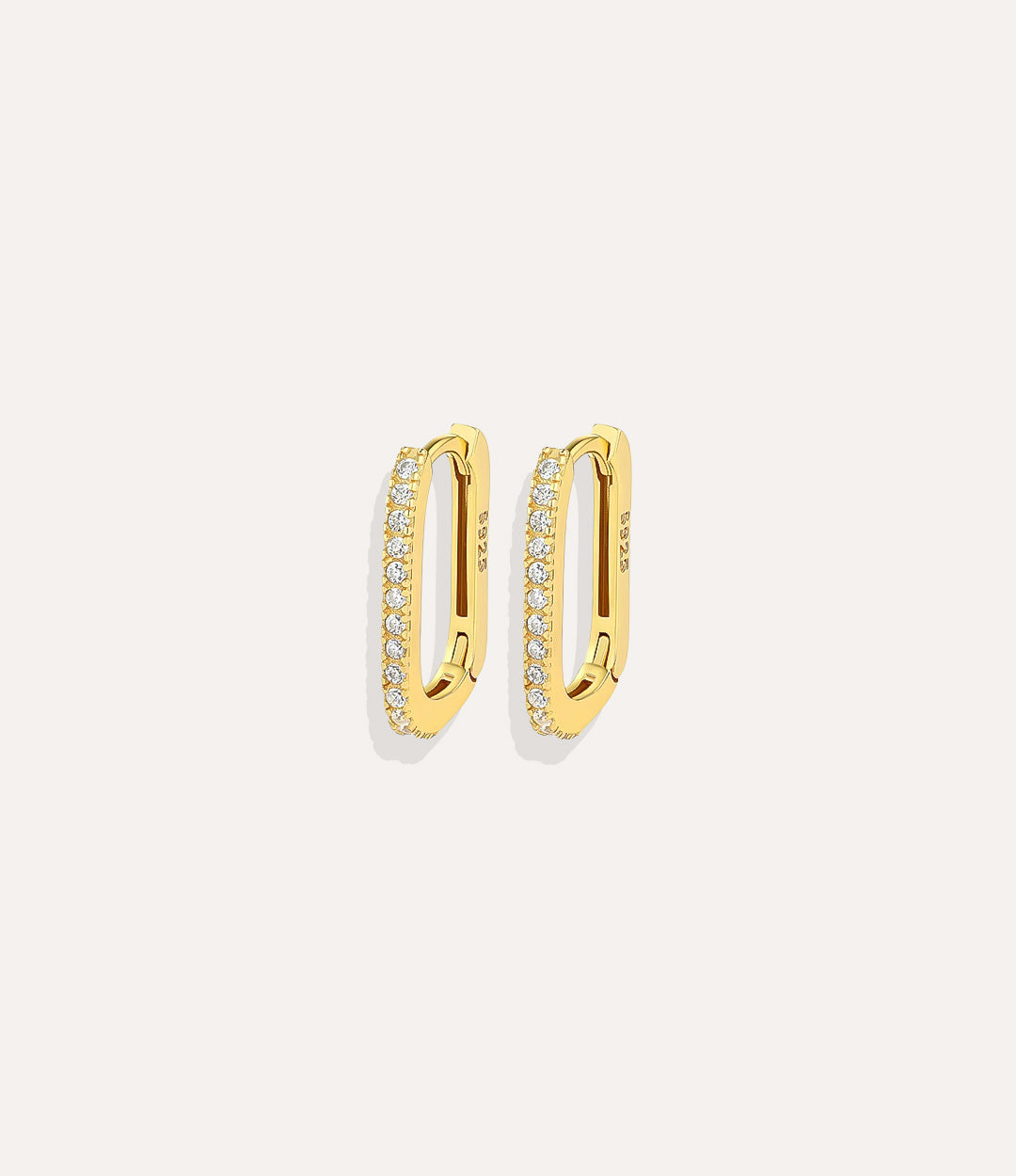 Close up of Oval Diamond Hoops in gold highlighting the elegant oval design and diamond details.