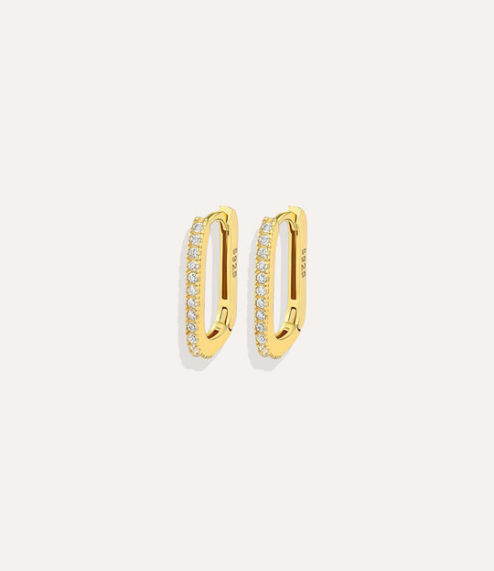 Close up of Oval Diamond Hoops in gold highlighting the elegant oval design and diamond details.