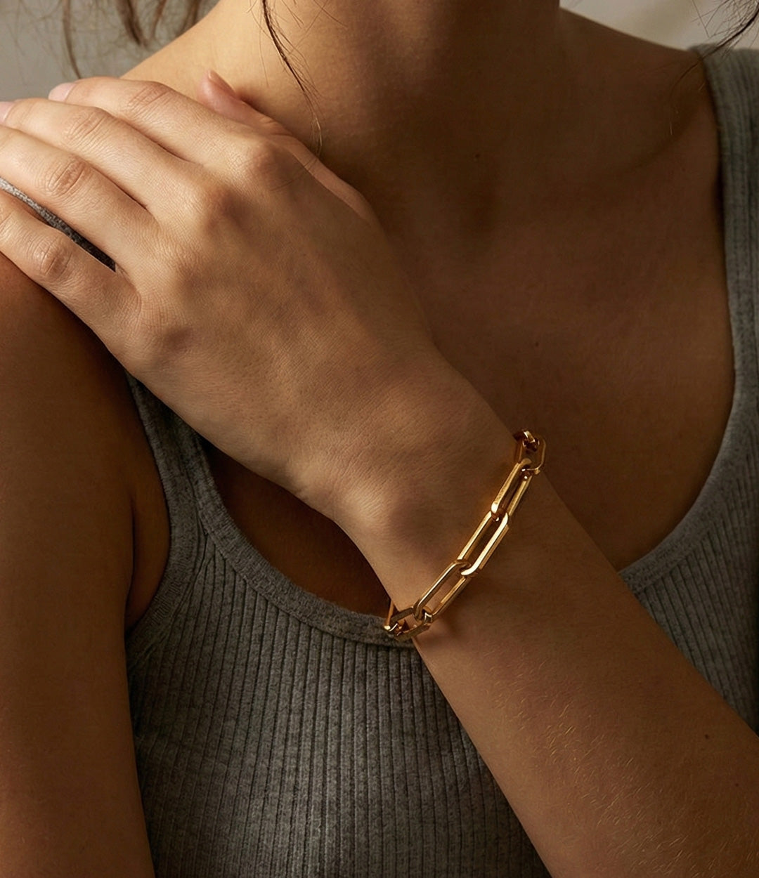 Model wearing the Oversized Paperclip Bracelet, showcasing its bold linked design and elegant wrist contour.