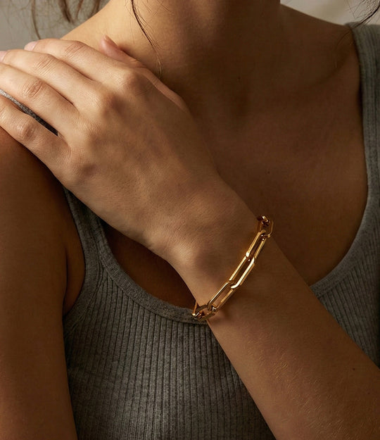 Model wearing the Oversized Paperclip Bracelet, showcasing its bold linked design and elegant wrist contour.