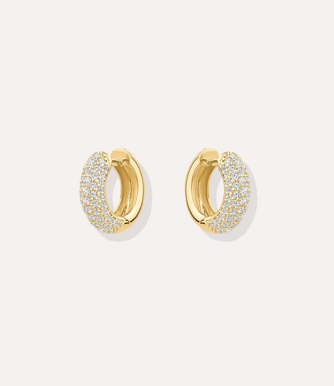 Close up of the gold Pave Hoops highlighting the detailed pave stones and polished gold finish.