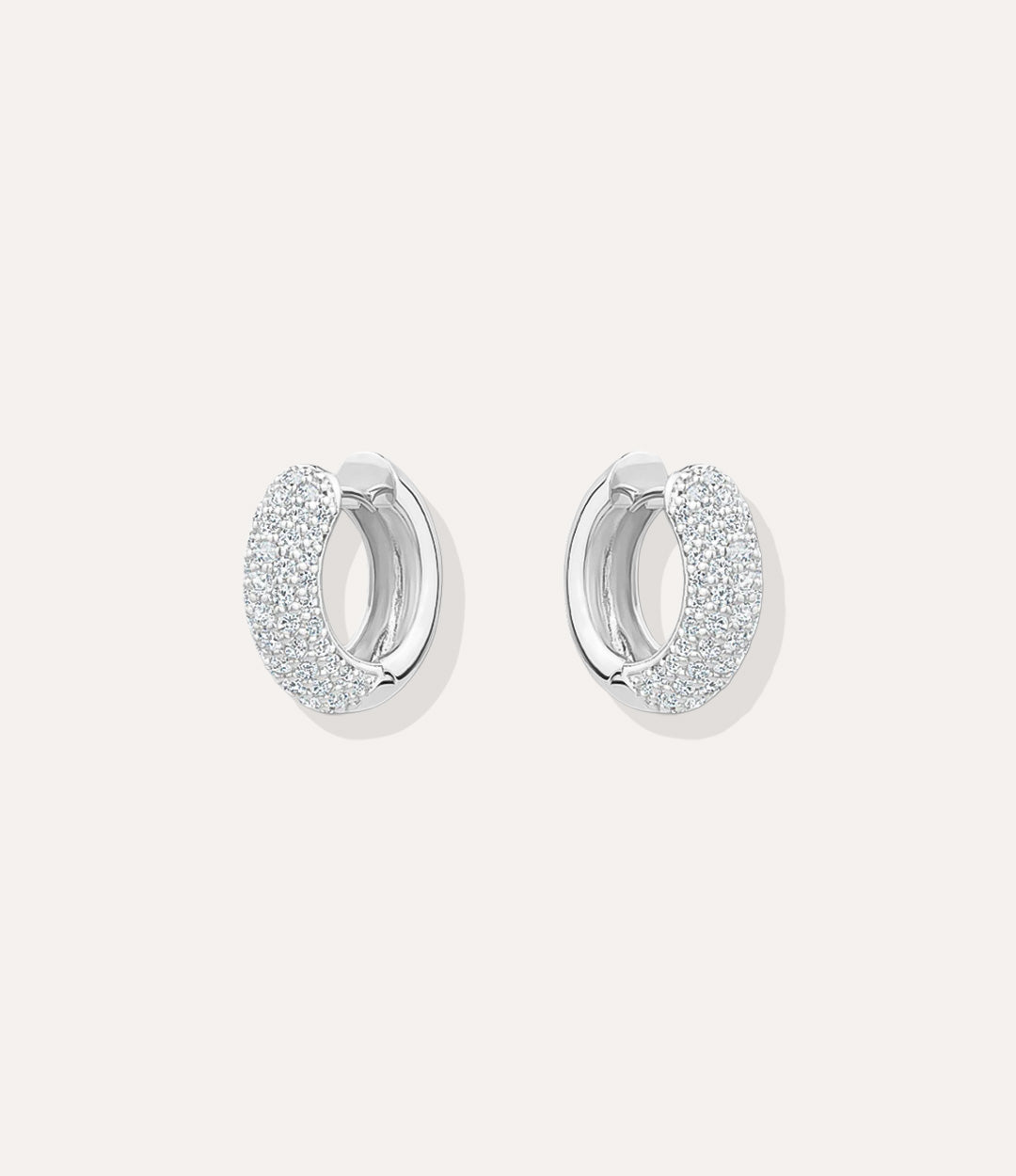Close up of the silver Pave Hoops showing the shimmering pave detailing and sleek silver plating.