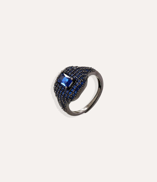 Ring with blue gemstone on a white background