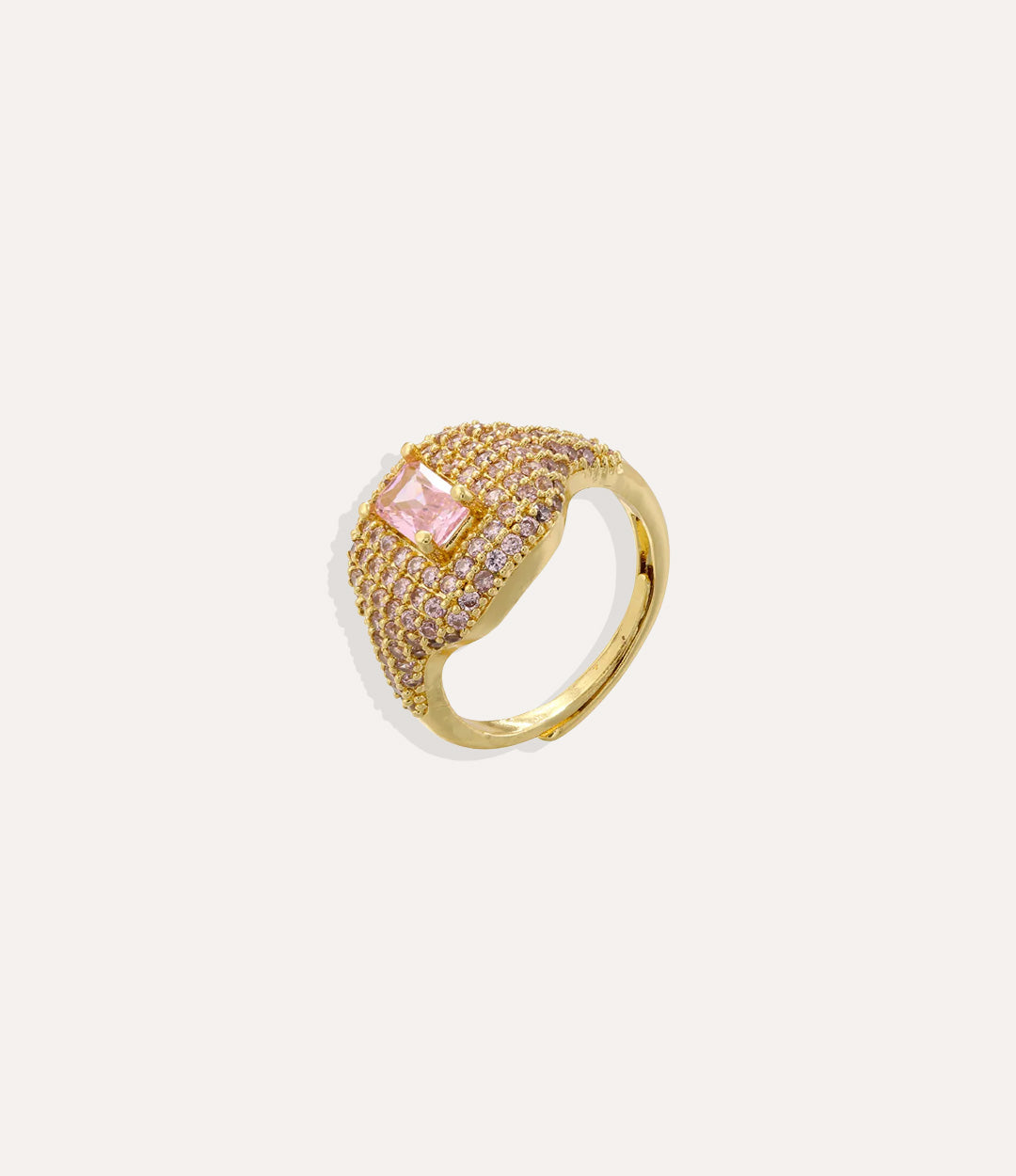 Gold ring with a pink gemstone on a white background