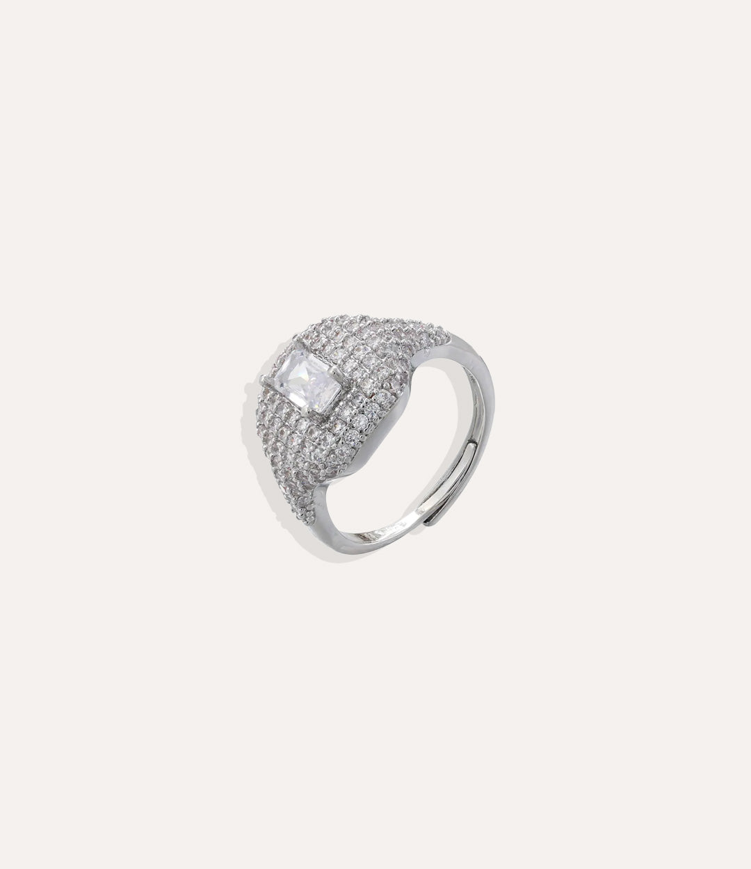 Silver ring with a large central gemstone and smaller stones on a white background