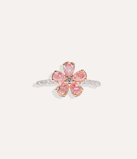 Sterling Silver Pink Flower Ring isolated on white, highlighting the polished silver band and brilliant diamond-adorned flower petals.