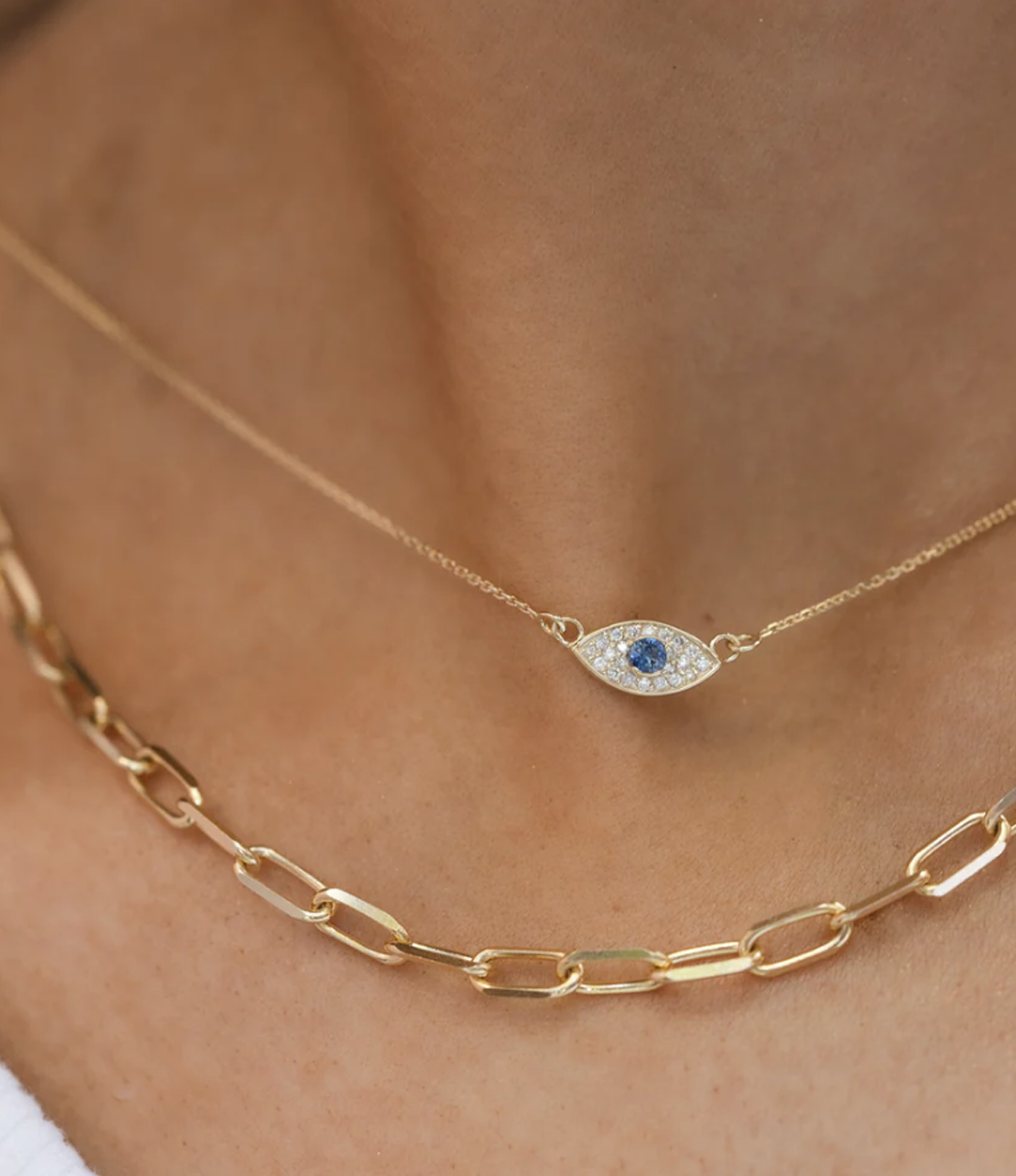 Layered Protection Necklace styled with other gold chain for a modern jewelry stack