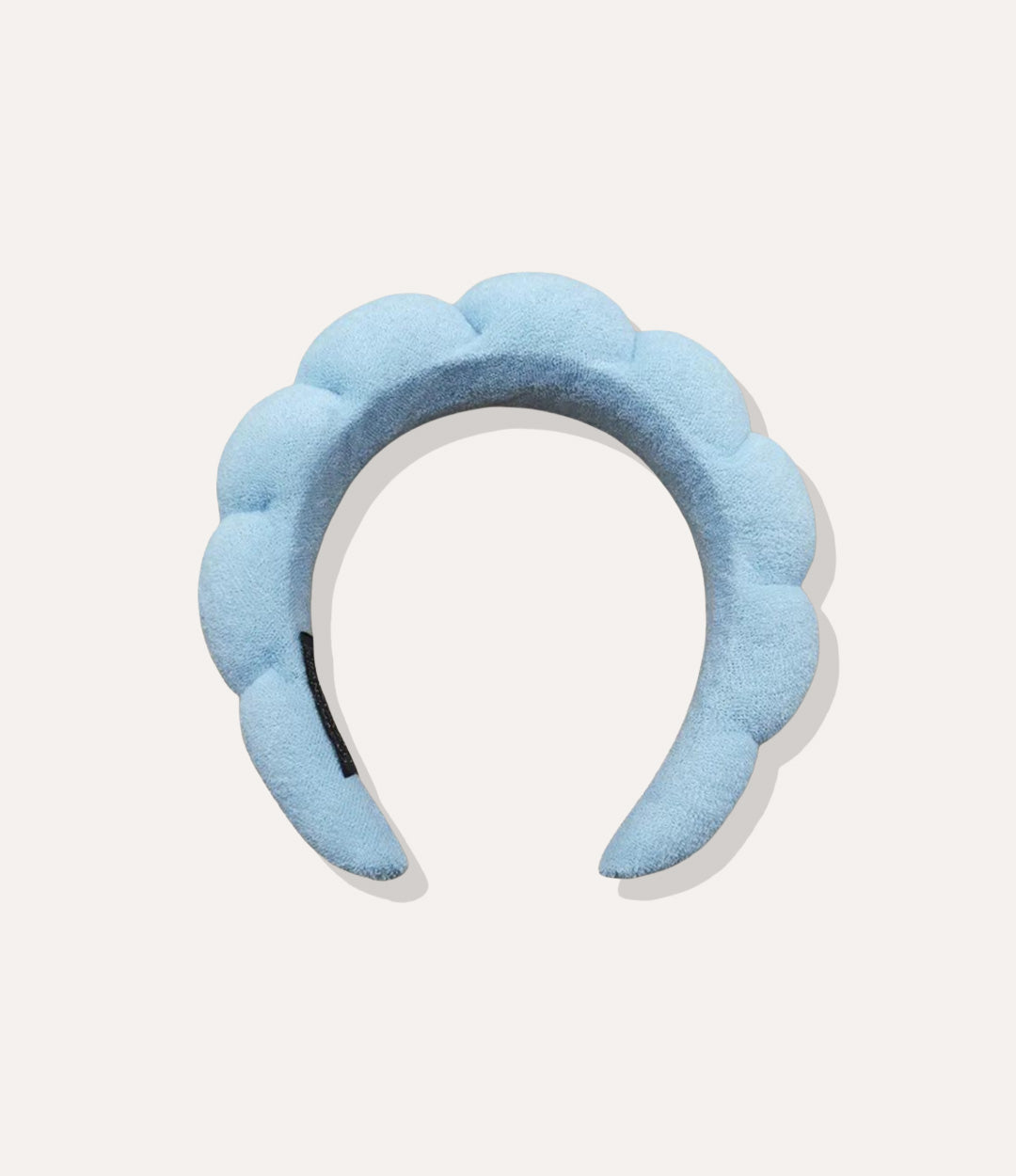 Puffy Towel Headband in blue, featuring a thick sponge-like design and soft terry cloth texture isolated on white.