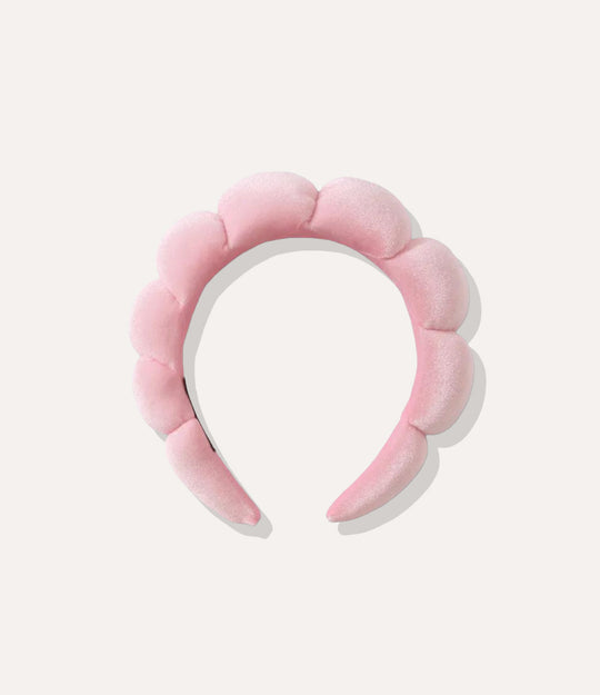 Puffy Towel Headband in pink, featuring a thick sponge-like design and soft terry cloth texture isolated on white.