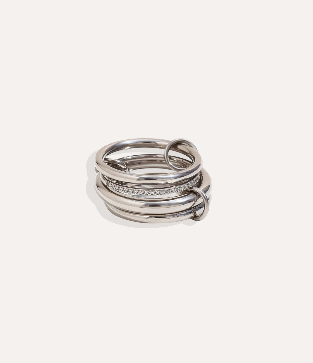 Set of silver rings stacked on a white background