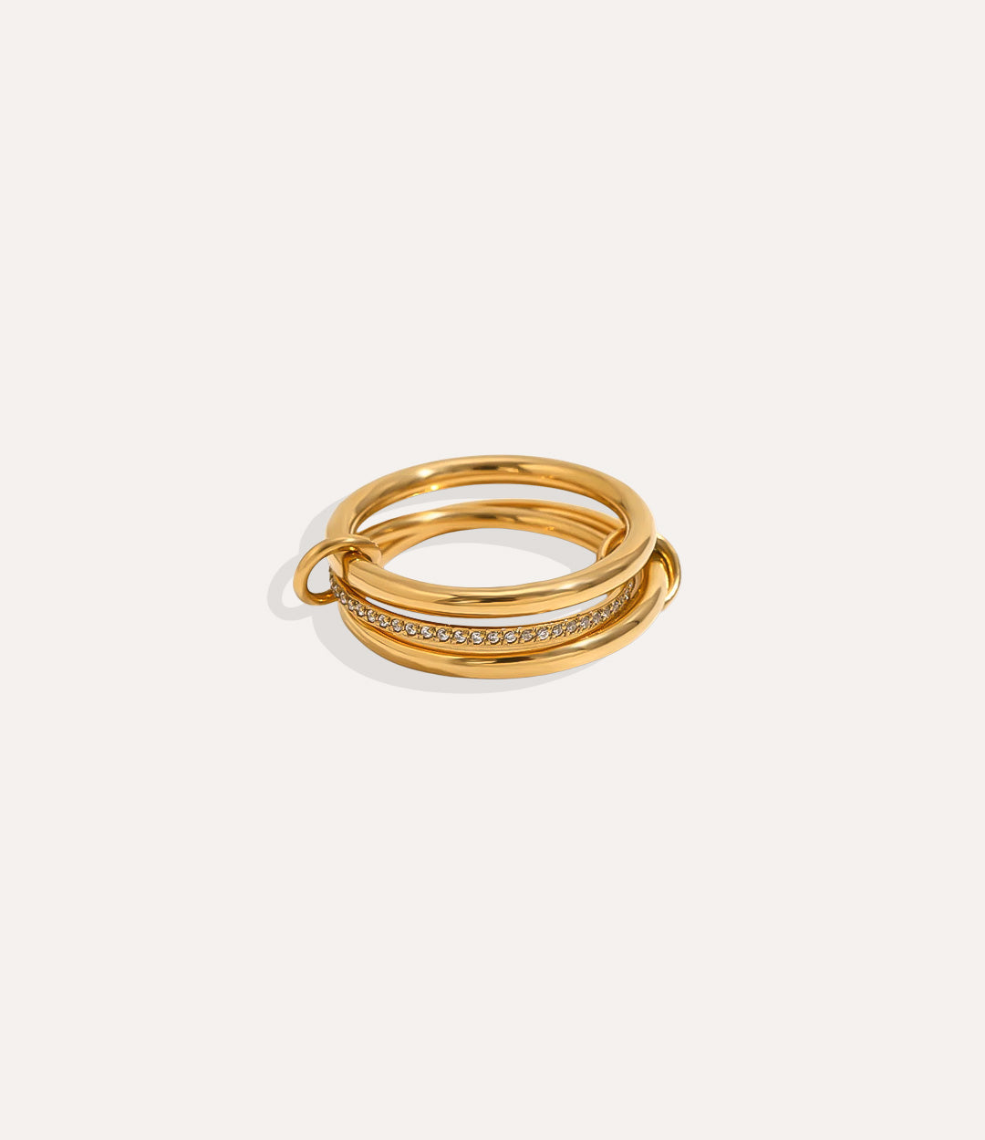 Gold ring with multiple bands on a white background