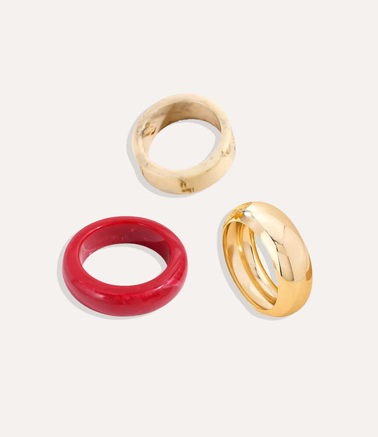 Set of three colourful resin bangles in varying shapes, stacked for a modern jewelry look.