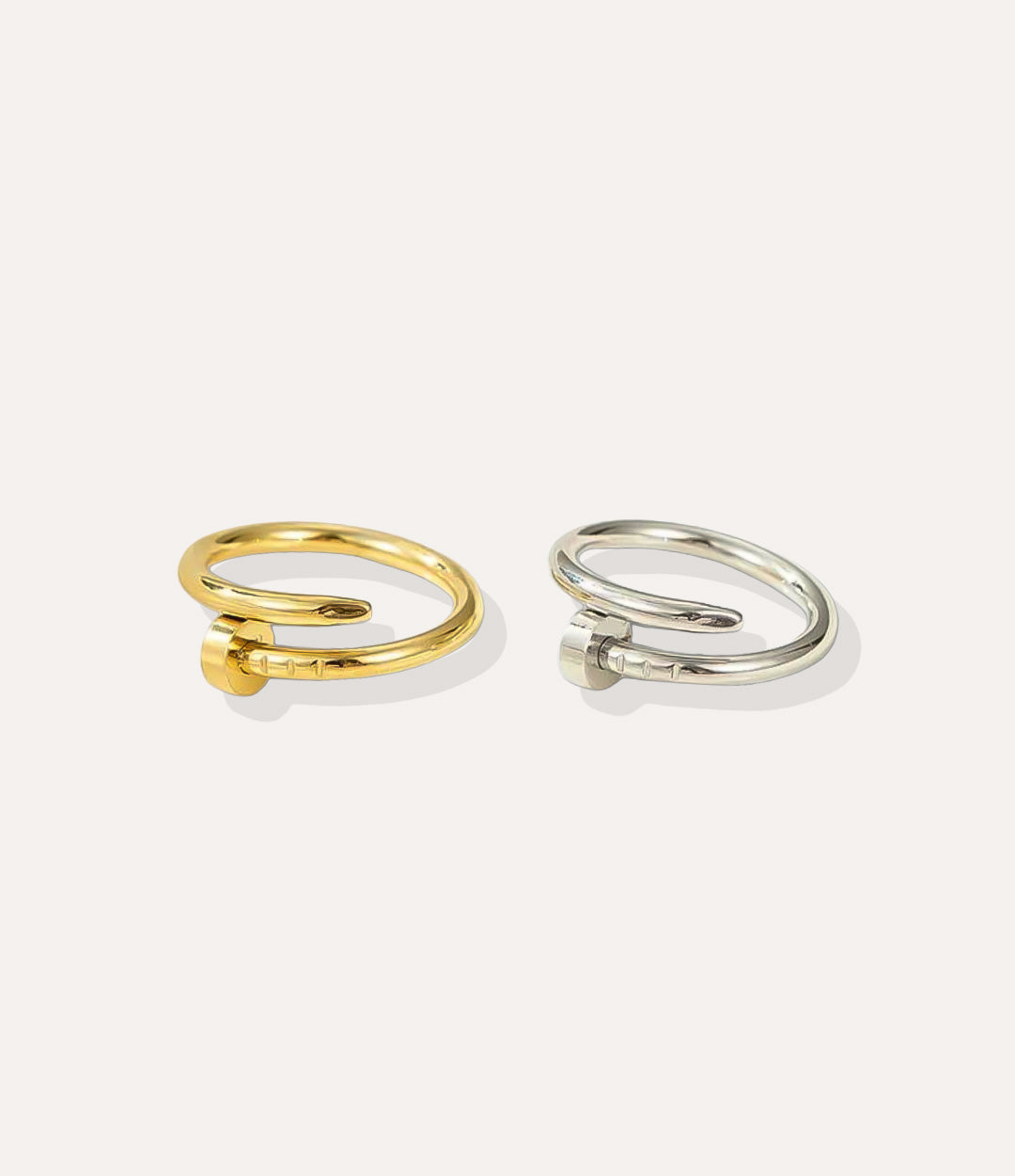 Screw Ring in gold and silver finish, featuring a polished band with engraved screw head motifs, isolated on a white background.