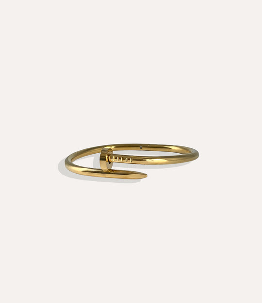 Screw Bracelet in 14K gold plated stainless steel featuring a sleek and modern screw design.