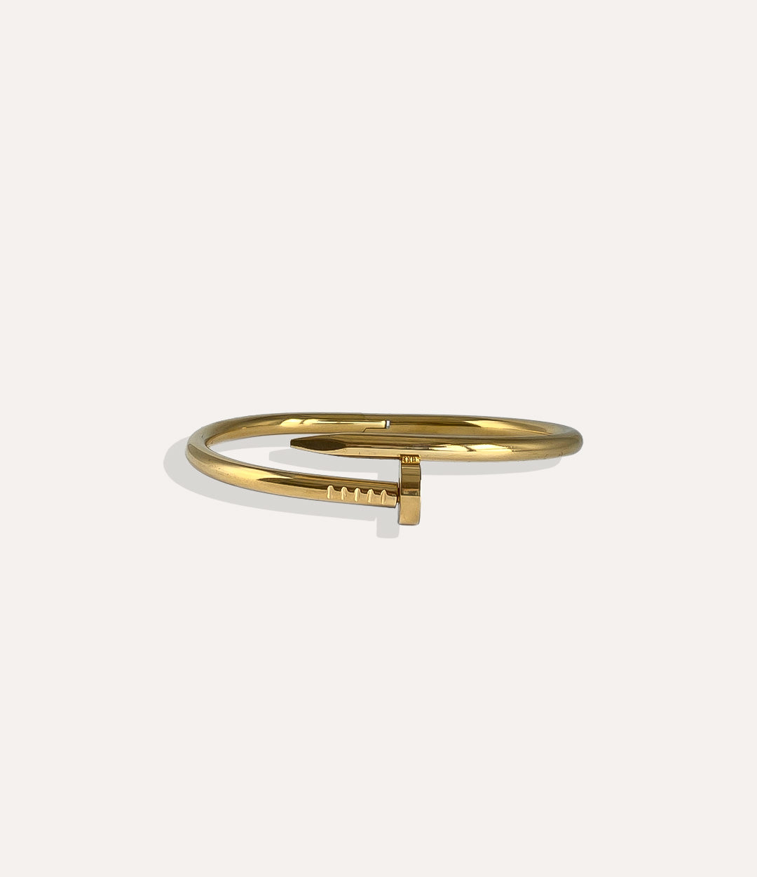 Screw Bracelet in 14K gold plated stainless steel featuring a sleek and modern screw design