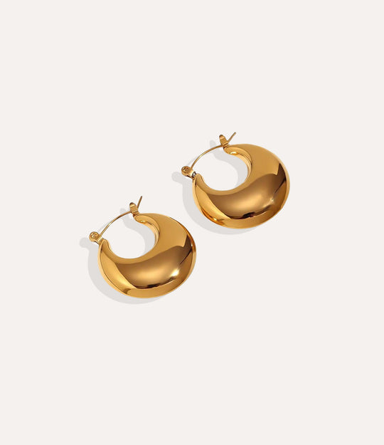 Product shot of the Slim Hoops in 18k gold plating displaying the slender round shape and high shine finish on a white background.