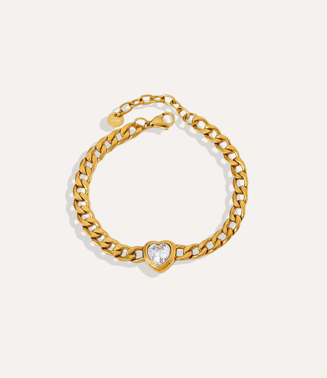 Solitaire Heart Chain Bracelet in gold, highlighting the clear heart pendant and chain detail.