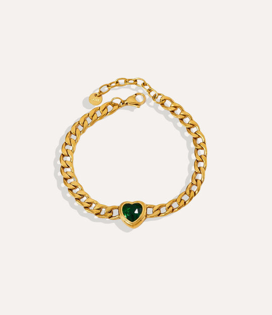 Solitaire Heart Chain Bracelet in gold, highlighting the green heart pendant and chain detail.
