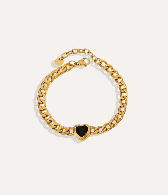 Solitaire Heart Chain Bracelet in gold, highlighting the black heart pendant and chain detail.