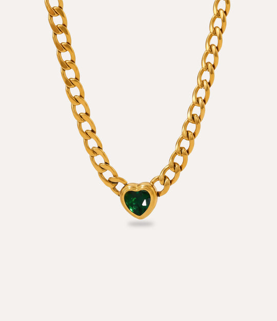 Chunky gold Solitaire Heart Chain Necklace with green heart pendant on neutral background