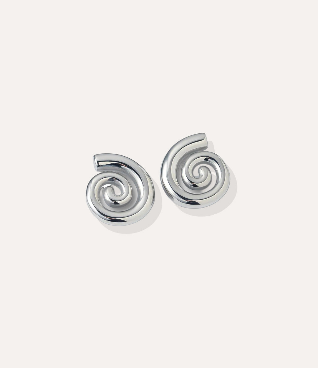 Close up of the Spiral Studs in silver, showing the smooth spiral design and stainless steel finish.