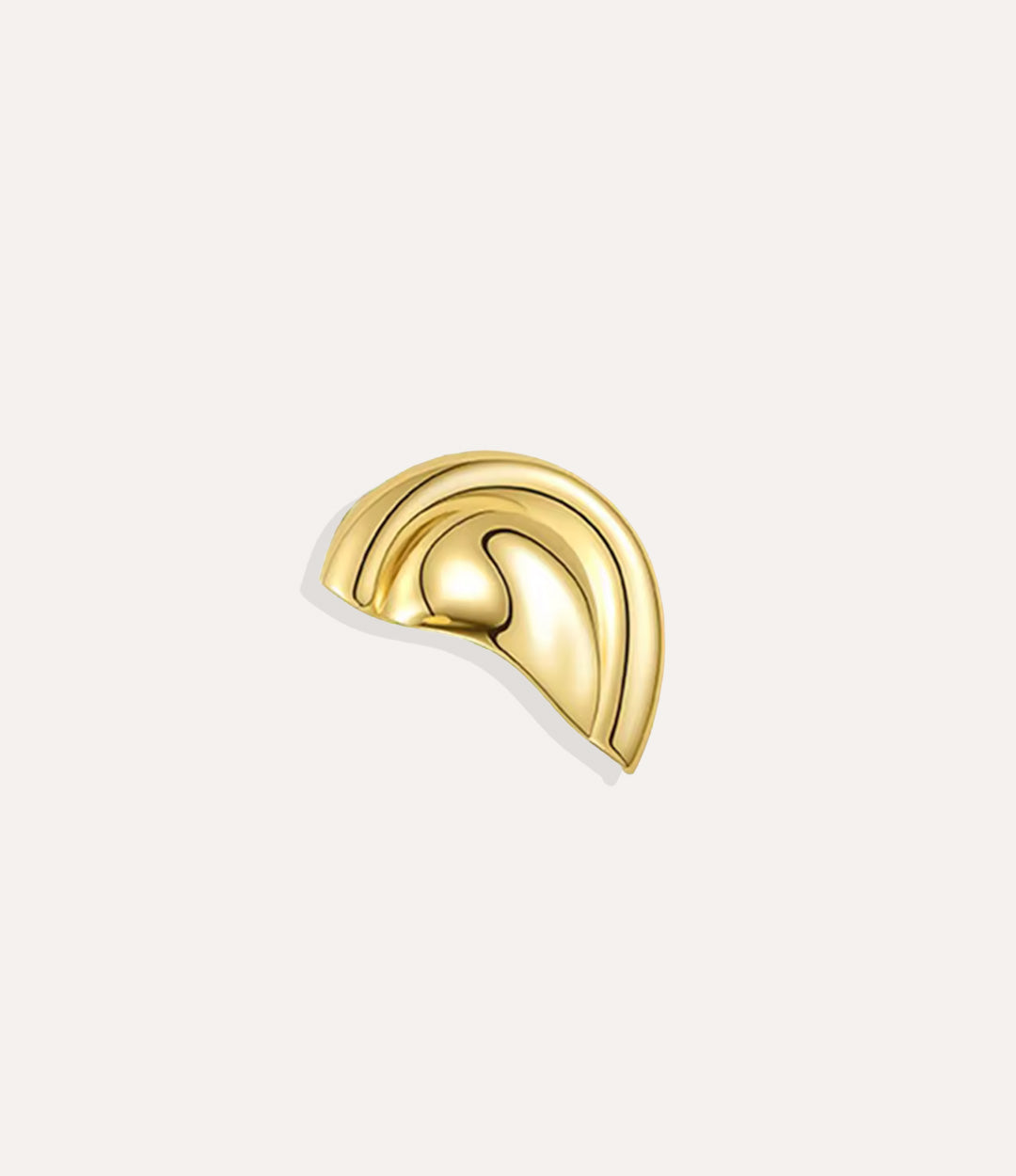 Close up of the Statement Ear Cuff in gold highlighting its bold sculptural design and polished finish.