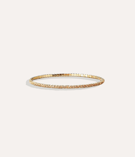 Stretch Tennis Bracelet in 14K gold-plated stainless steel with vibrant gold gemstone accents displayed in a close-up product image.