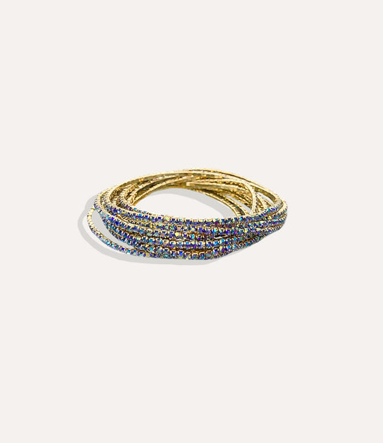 Stretch Tennis Bracelet in 14K gold-plated stainless steel with vibrant dark blue gemstone accents displayed in a close-up product image.