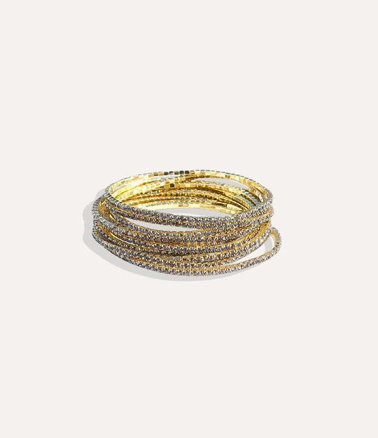 Stretch Tennis Bracelet in 14K gold-plated stainless steel with gray vibrant gemstone accents displayed in a close-up product image.
