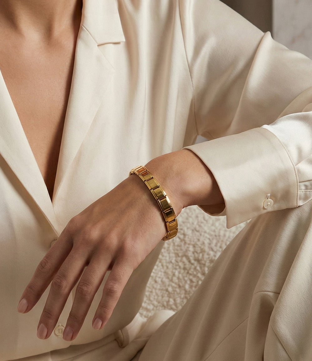Model wearing the Stretch Watch Band bracelet in gold.