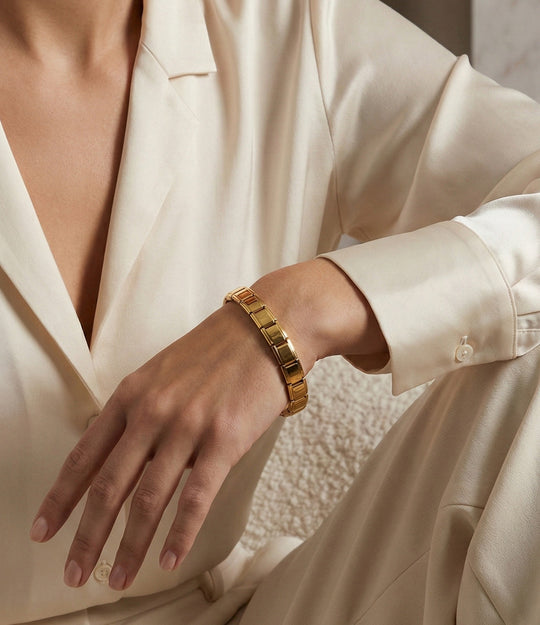 Model wearing the Stretch Watch Band bracelet in gold.