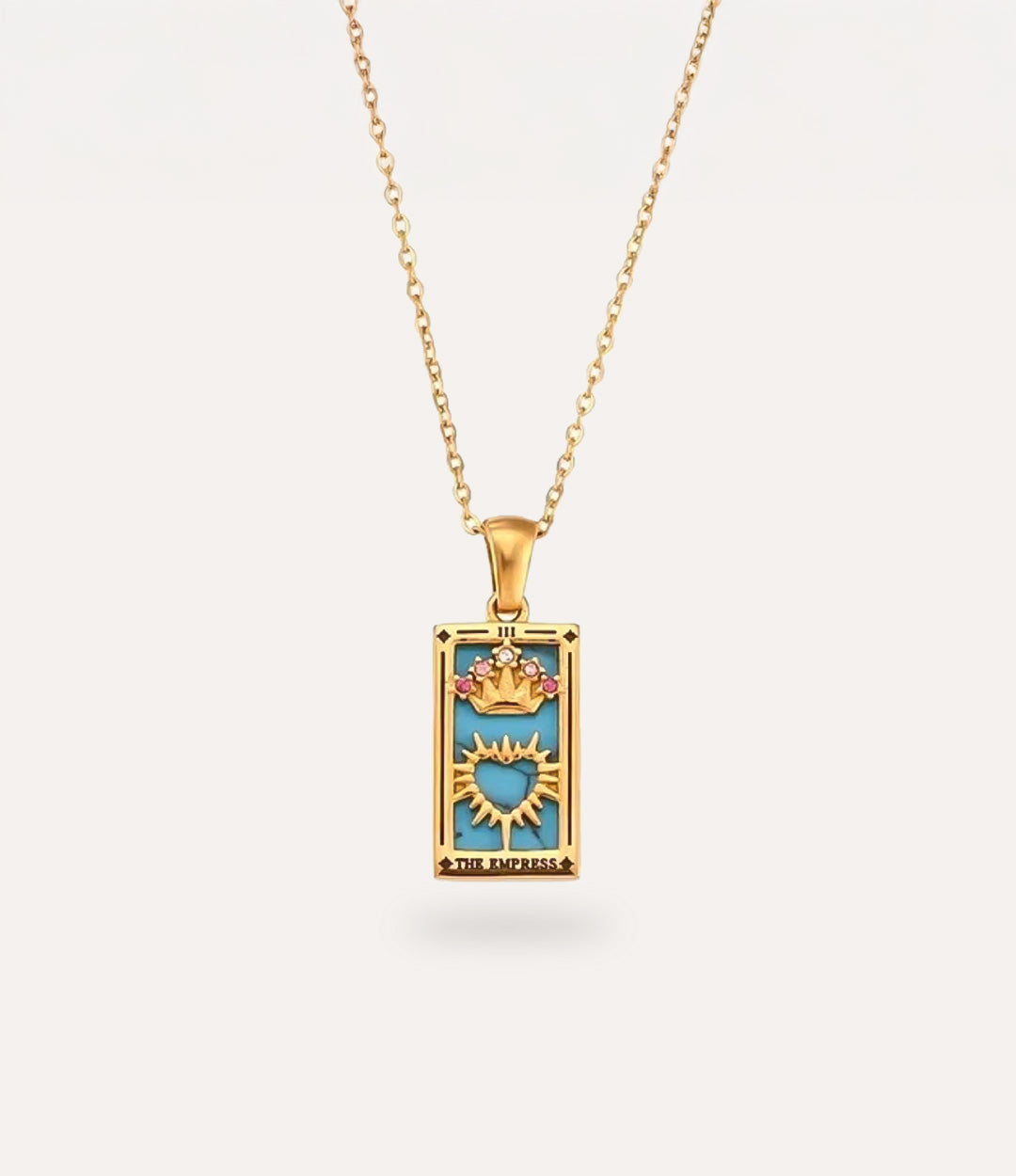 The empress - gold tarot card pendant necklace with link chain displayed on a neutral background.